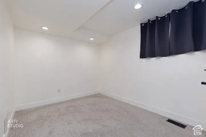 Neutral-toned carpeting paired with white walls