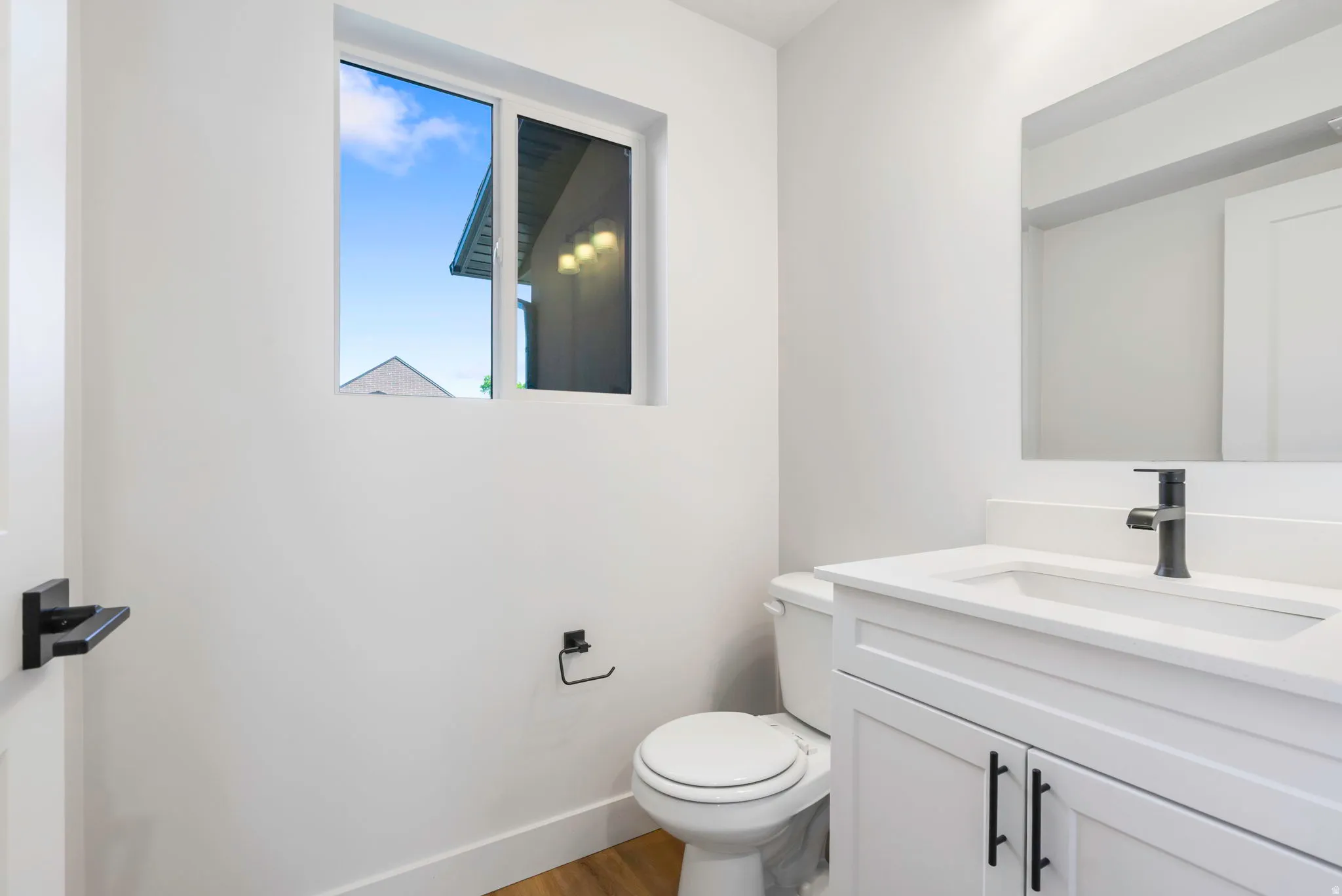 Bathroom vanity with a white countertop and integrated sink
