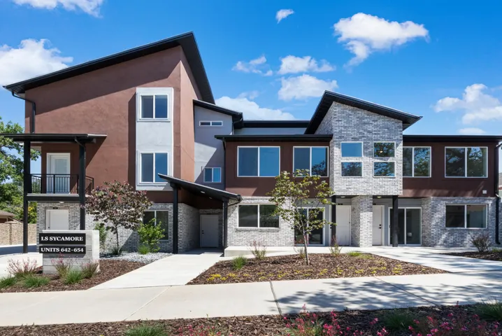 Modern multi-unit building featuring a contemporary design with varied facade materials