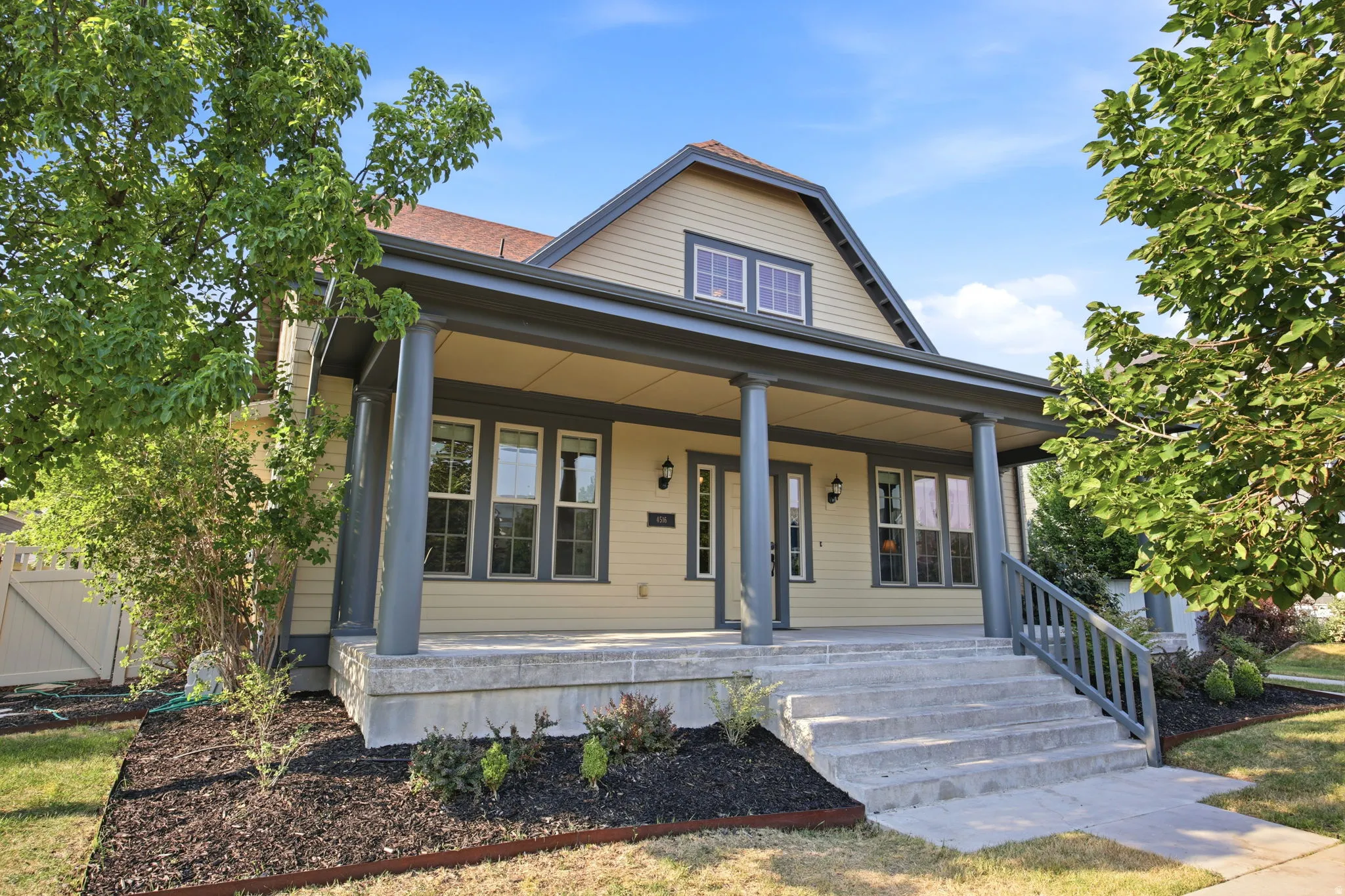 Inviting covered front porch with substantial columns