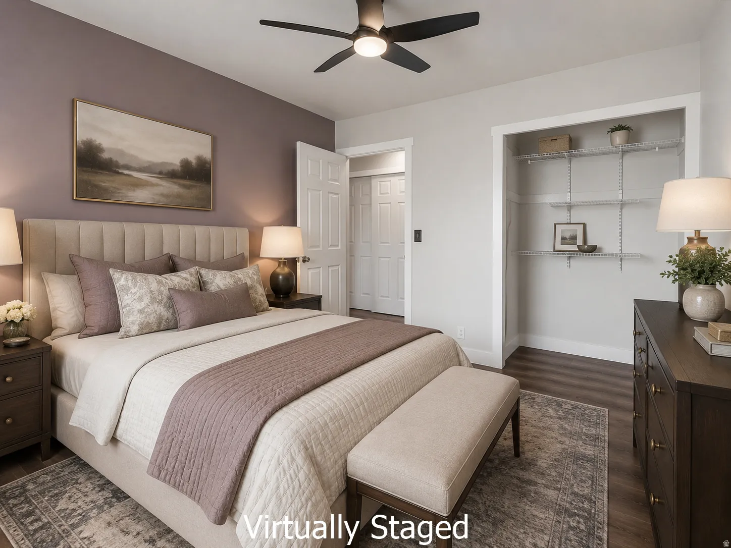 Bedroom featuring a ceiling fan with integrated lighting, wood-finish flooring, and a closet with wire shelving