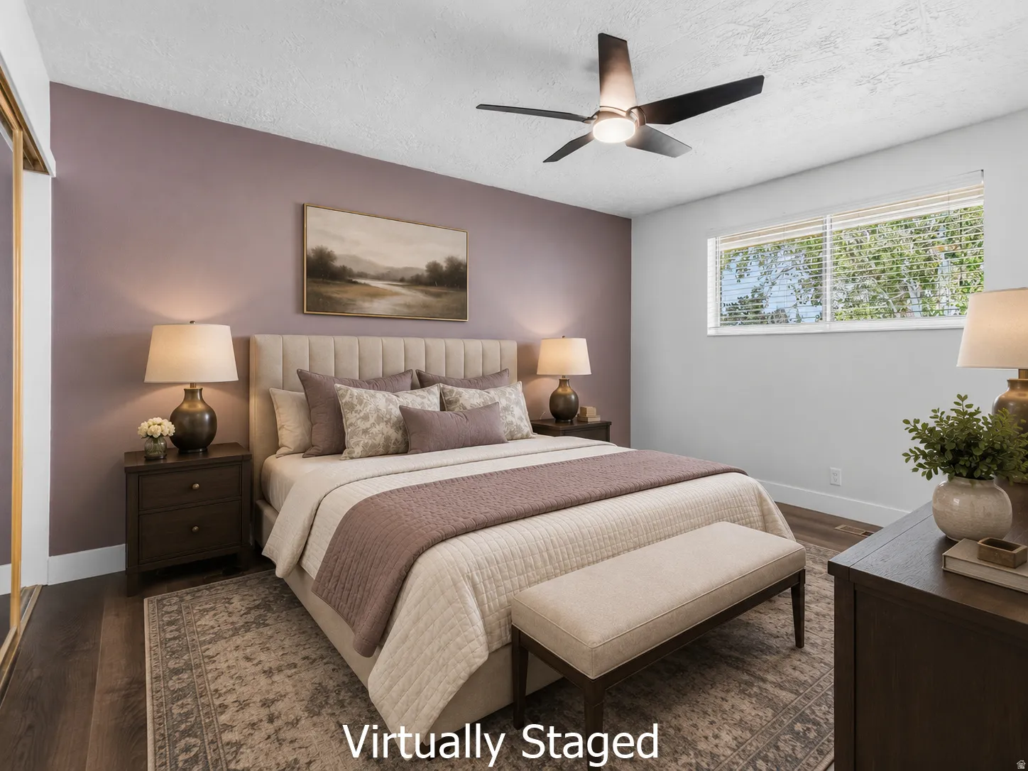 Spacious bedroom featuring wood-finish flooring, a contemporary ceiling fan, and a large window with horizontal blinds