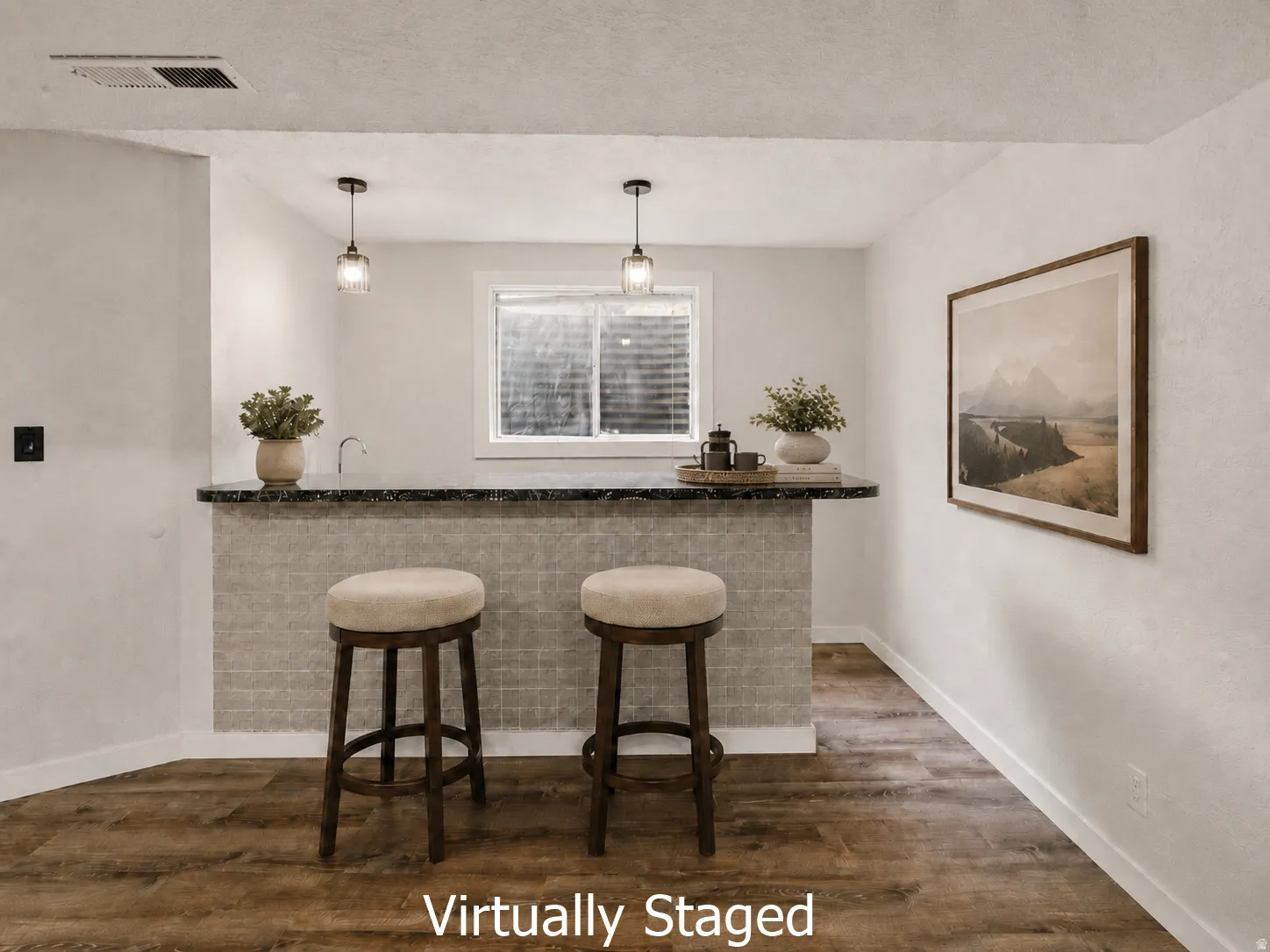 Built-in bar with stone-look countertop, integrated sink, and pendant lighting
