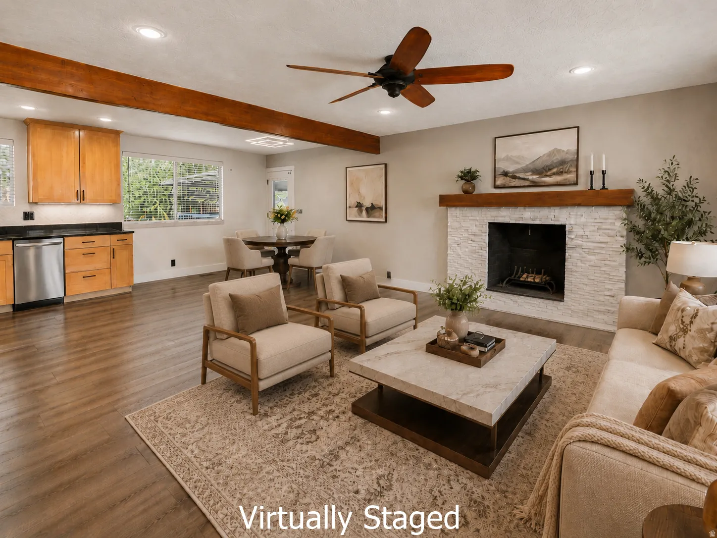 Open-concept living area featuring a stone-clad fireplace with a wood mantel, wood-finish flooring, and exposed ceiling beams