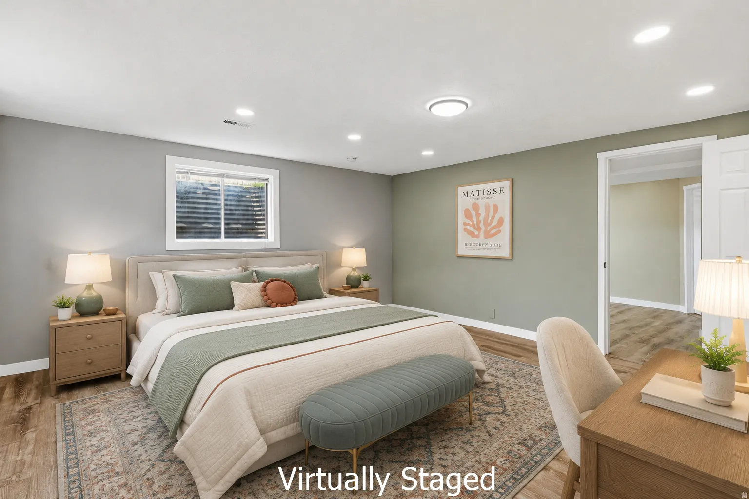 Bedroom featuring wood-finish flooring, recessed lighting, a white trim window, and a paneled interior door