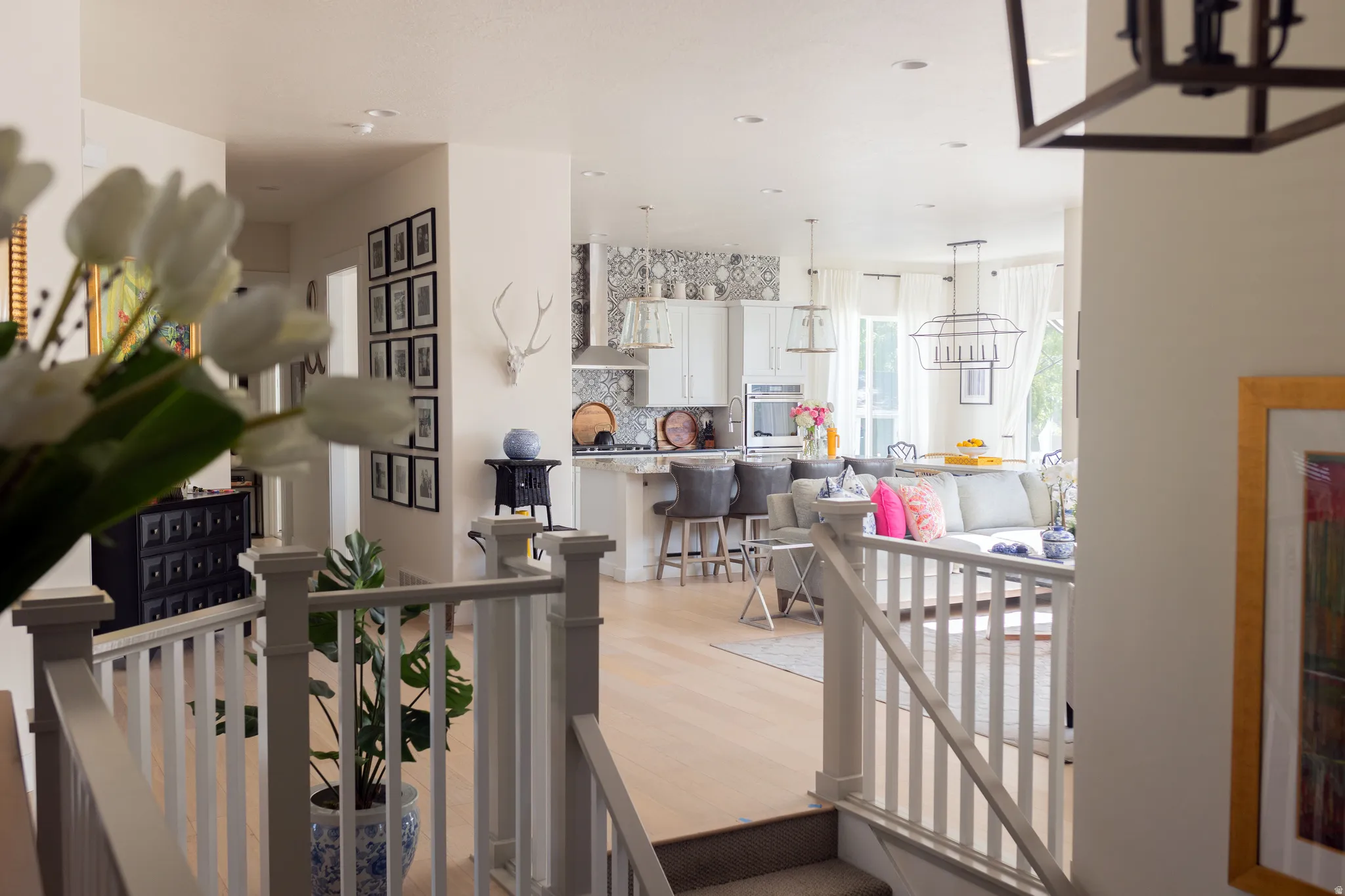 Open-concept living space featuring light wood-finish flooring throughout