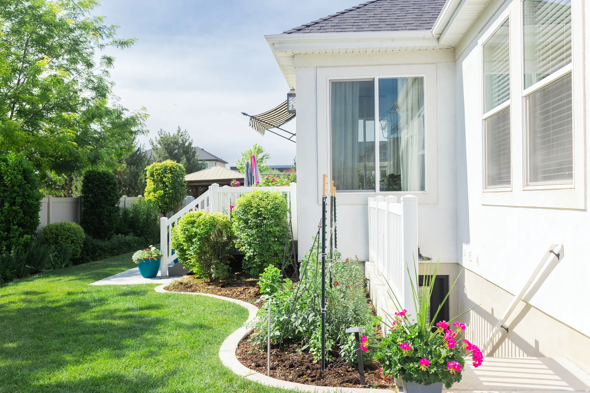 Mother-in-law exterior entrance. Curbing around flowerbeds. North East corner of home.