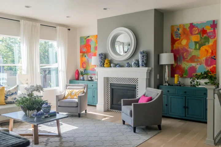 Living area featuring a white mantel fireplace with a dark firebox, light wood-finish flooring, recessed lighting, and large windows