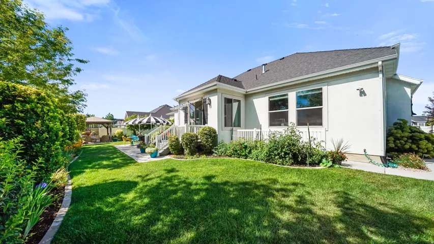 Expansive green lawn bordering a stucco exterior