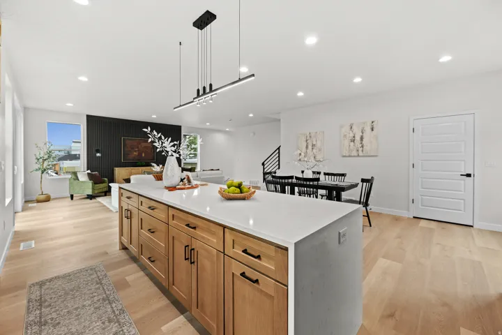 Spacious kitchen island with a light-toned countertop and wood-finish cabinetry