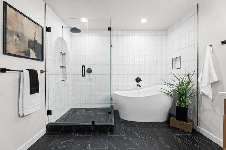 Bathroom with a freestanding soaking tub and a glass-enclosed shower