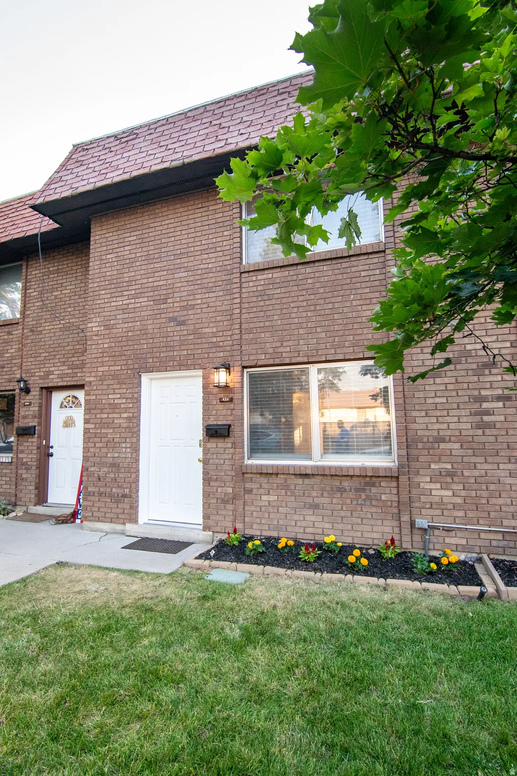 Brick exterior facade with a tiled roofline