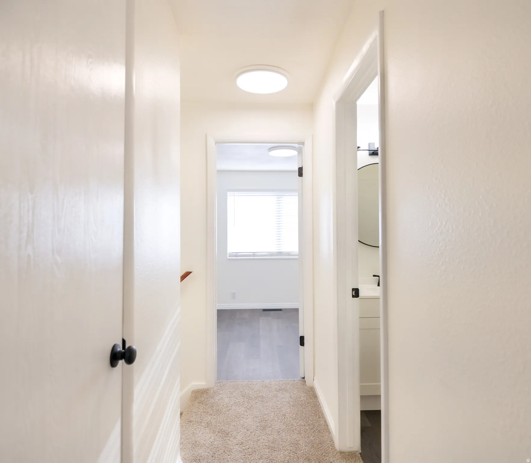 Hallway with carpet flooring and recessed lighting
