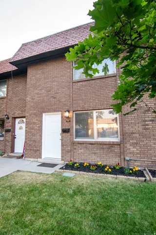 Brick exterior facade with a tiled roofline