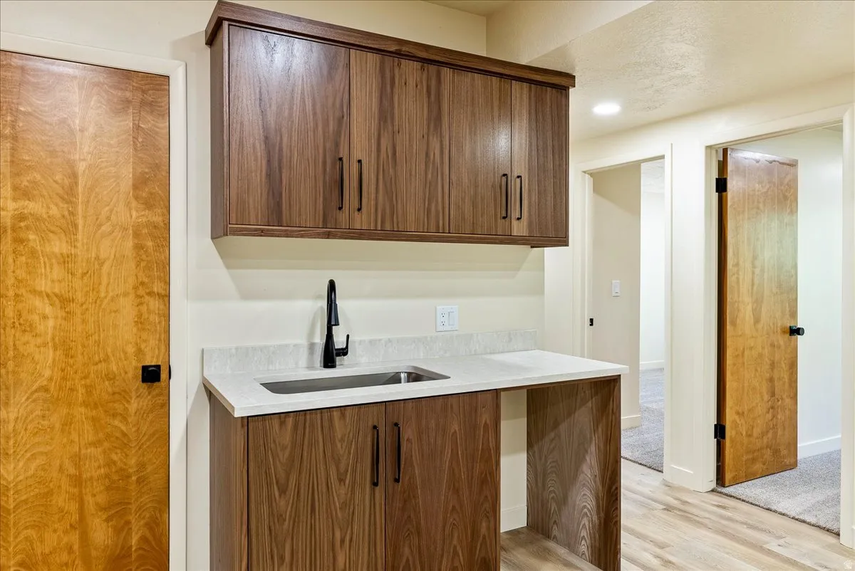 Built-in cabinetry with wood-finish doors and black hardware