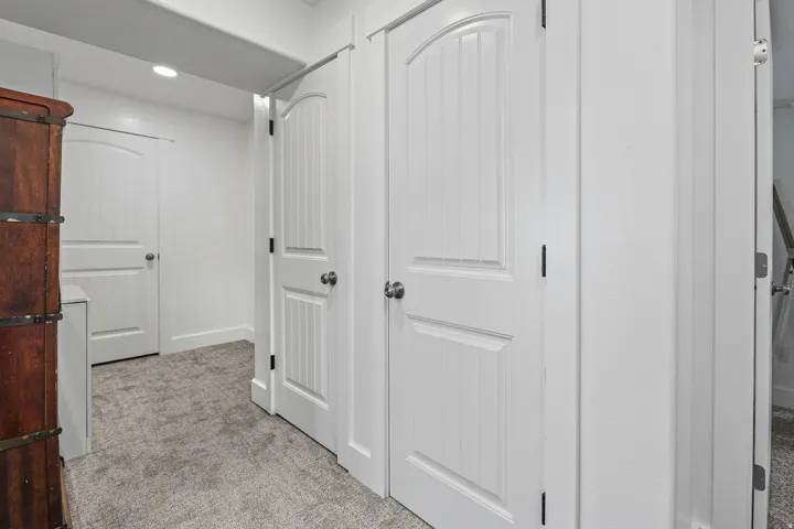 Wide hallway leading to 2 more bedrooms and a large full bath