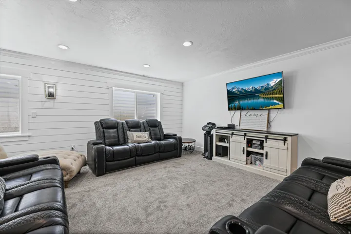 Relax while viewing the television. Added Shiplap has been added to add character to this family/gameroom