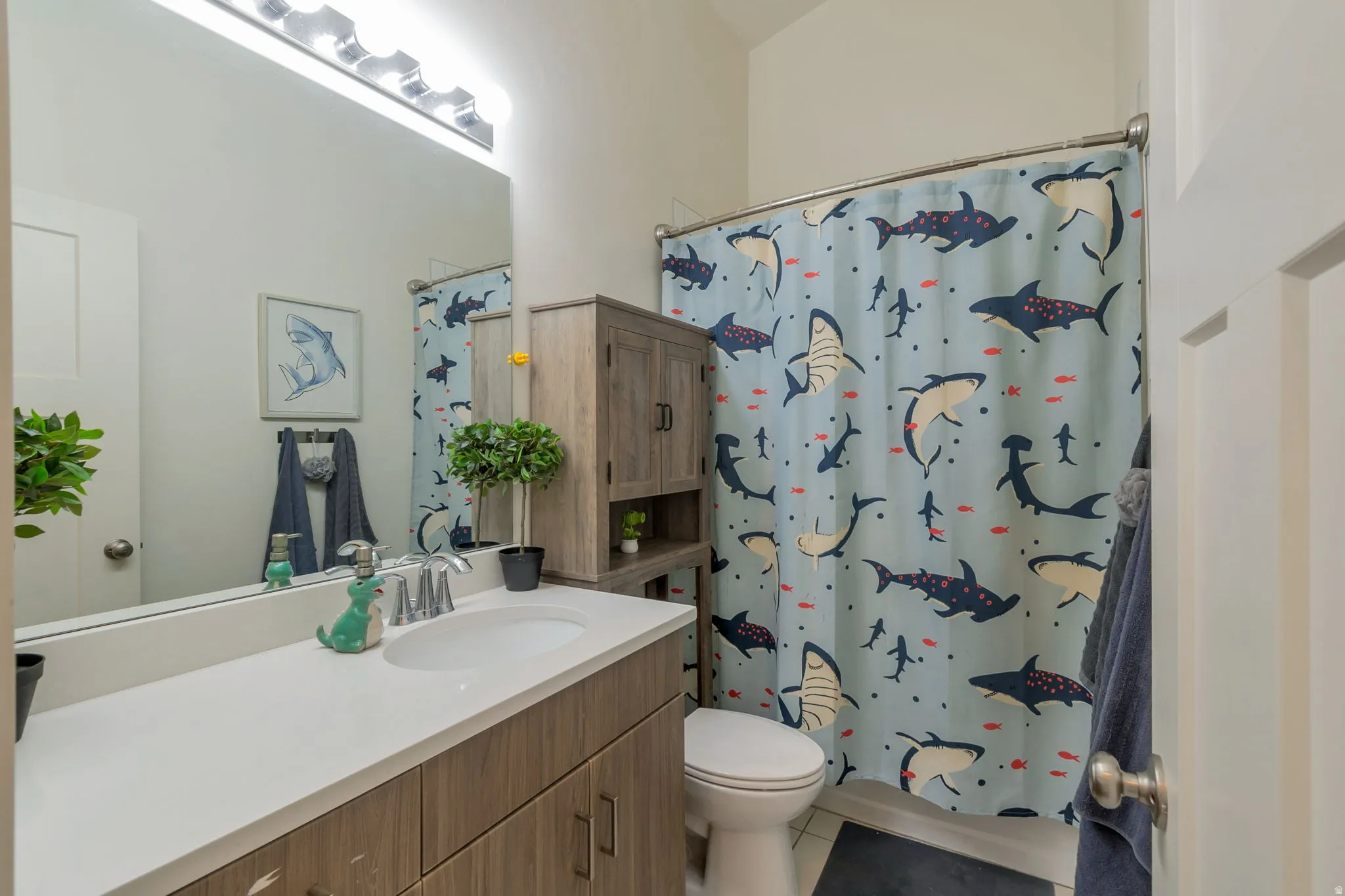 Bathroom vanity with an integrated sink and a large mirror