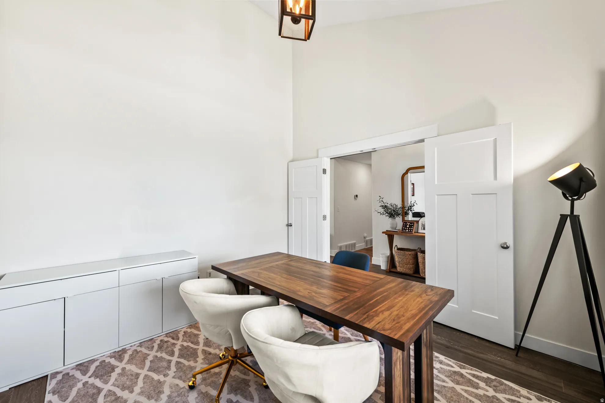Spacious room with wood-finish flooring and high ceilings