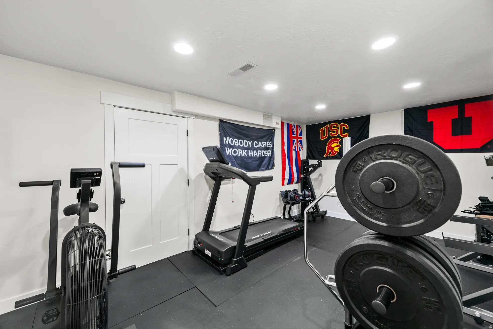 Dedicated fitness room featuring recessed lighting, and a durable rubber mat flooring.