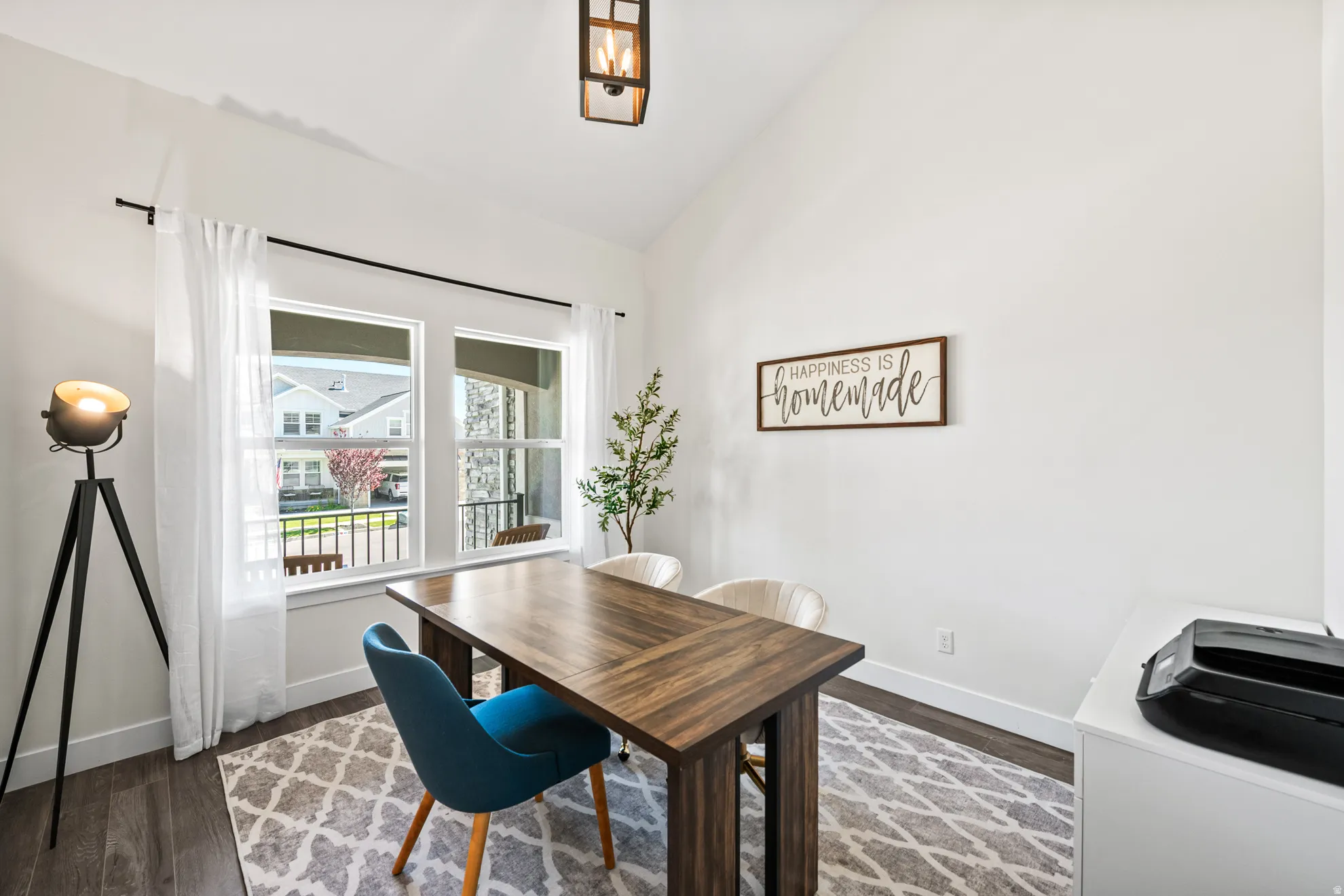 Spacious room with wood-finish flooring and high ceilings