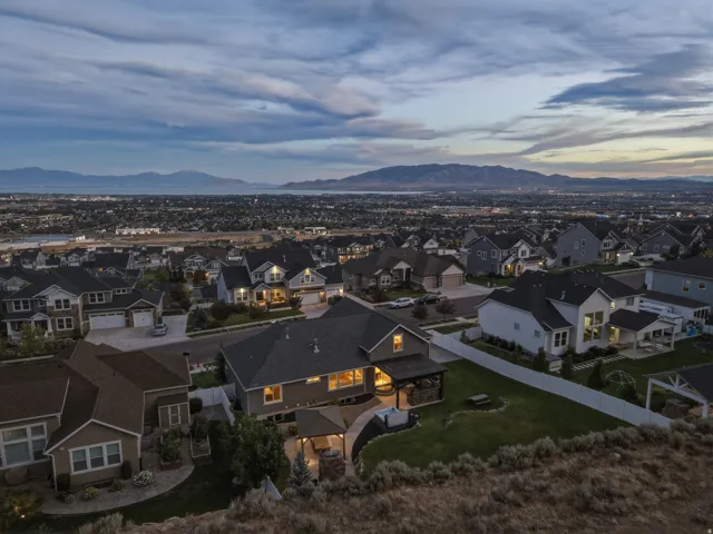 Expansive community featuring diverse residential architecture and distant mountain ranges