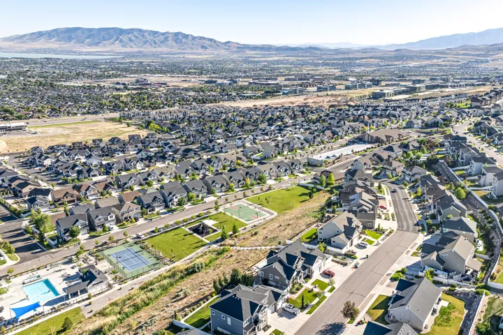Aerial view of community pool, tennis court and basketball court