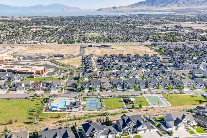 Aerial view of community pool, tennis court and basketball court