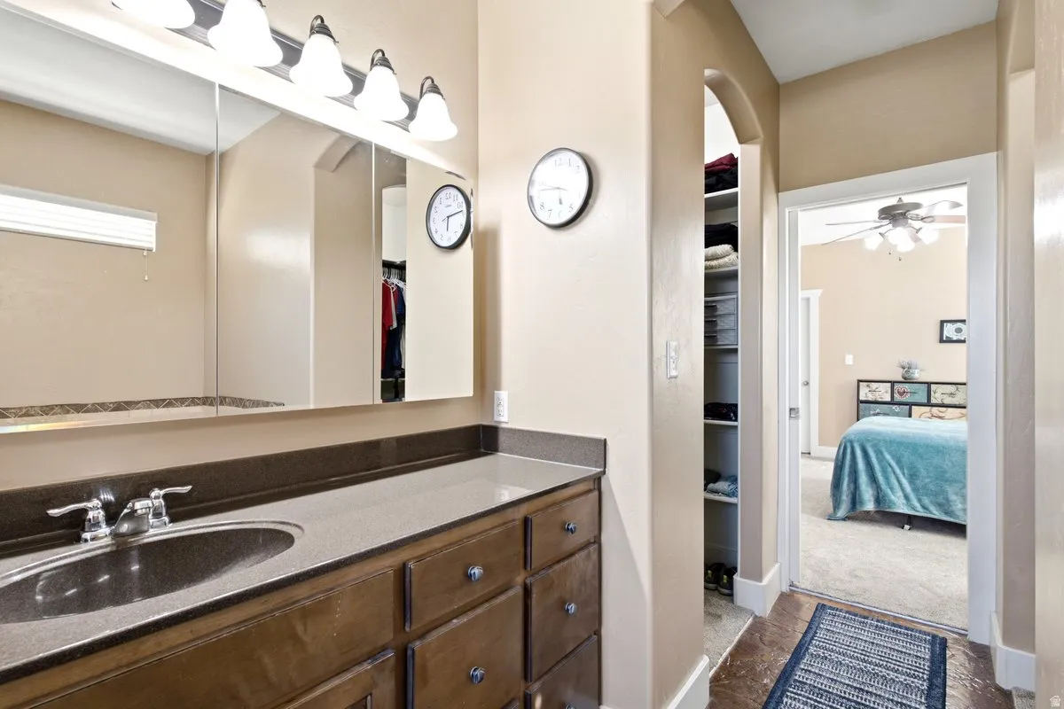 Primary bathroom with plenty of counterspace, storage and two walk in closets.
