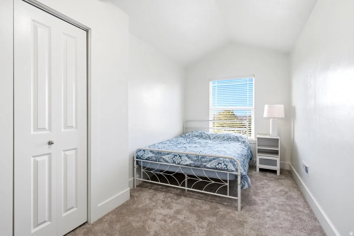 Bedroom 3 with vaulted ceiling and mountain views