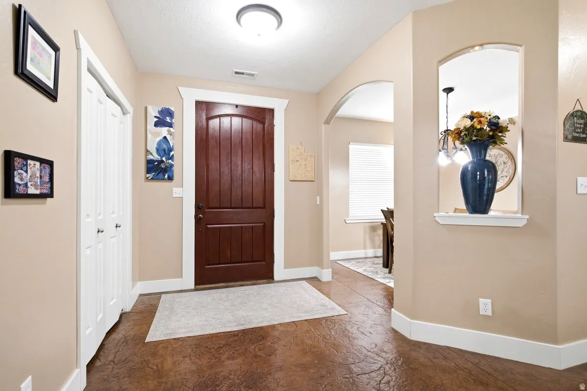 Large welcoming entryway with storage