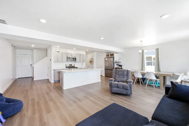 Open-concept living area with wood-finish flooring