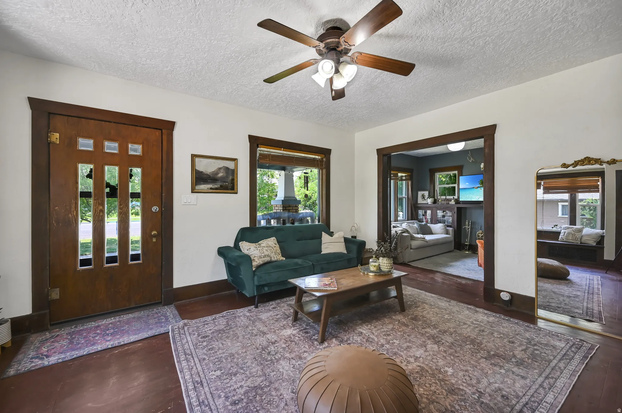Hardwood flooring throughout the entry and living area