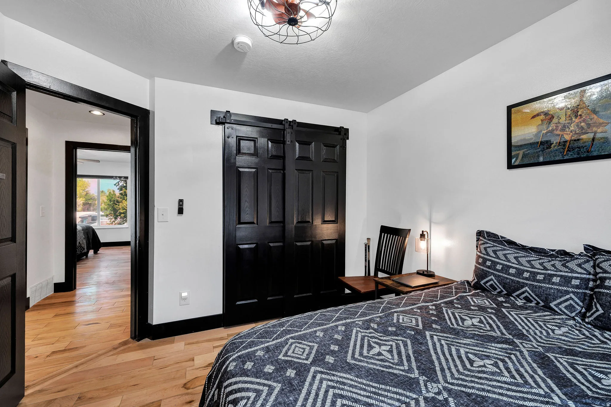 White walls contrasting with black trim and doors