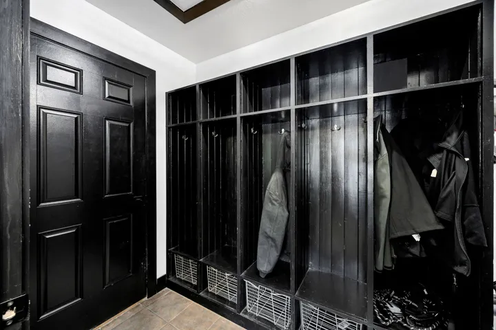 Built-in mudroom lockers with integrated storage, hooks, and shelving