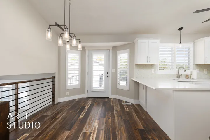 Open-concept dining area featuring wood-finish flooring