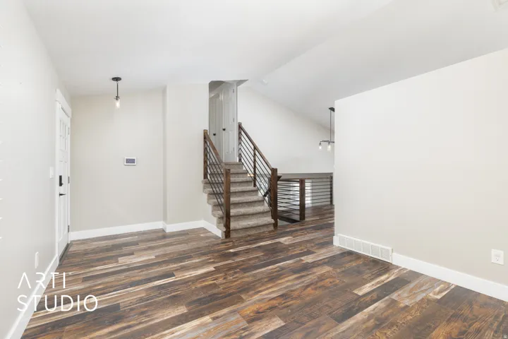Spacious entry area featuring wood-finish flooring
