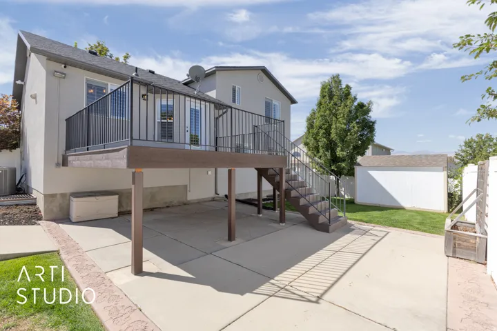 Elevated deck with dark railings and staircase