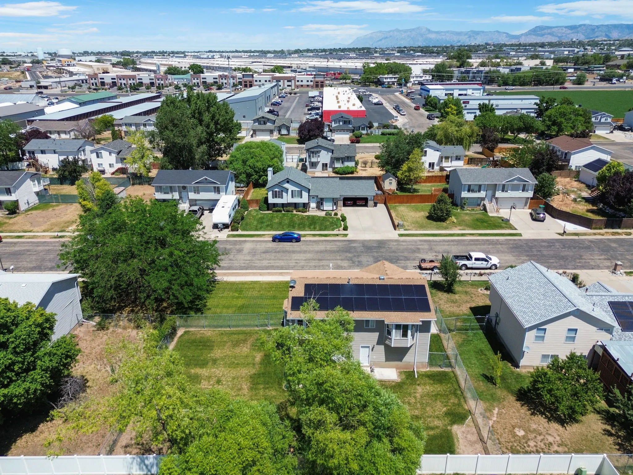 Rear property with a fenced yard and established trees