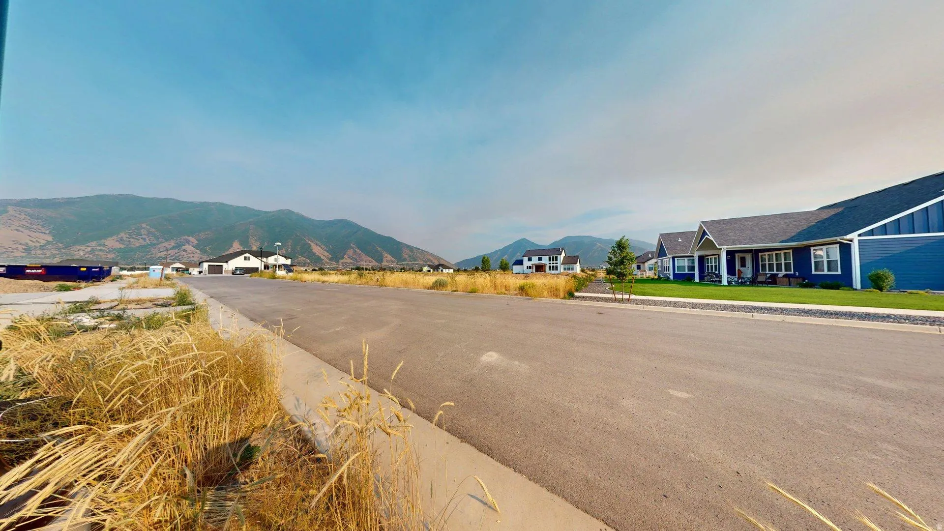 Paved streetscape with mountain scenery