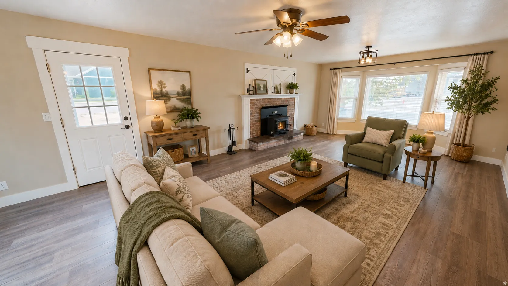 Ai enhanced photo. Living area featuring wood-finish flooring, a brick fireplace with a wood-burning stove, large windows with white trim, and a ceiling fan with light fixture