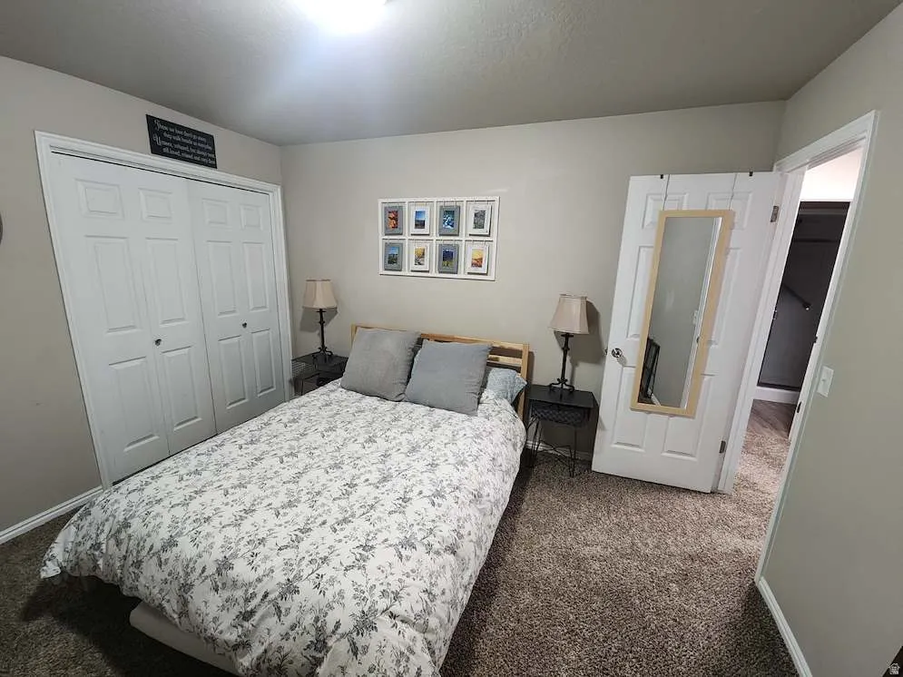 Neutral wall tones complement the textured carpeting