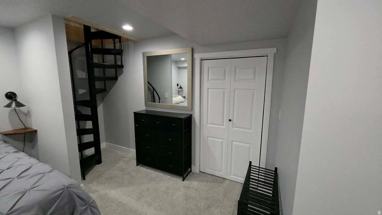 Black spiral staircase with wood-finish treads