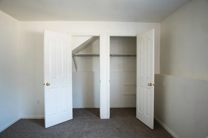 Double bifold closet doors opening to two storage compartments