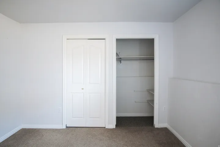 Neutral wall paint with white baseboards and trim