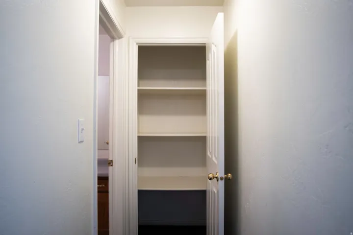 Recessed pantry with multiple shelving units