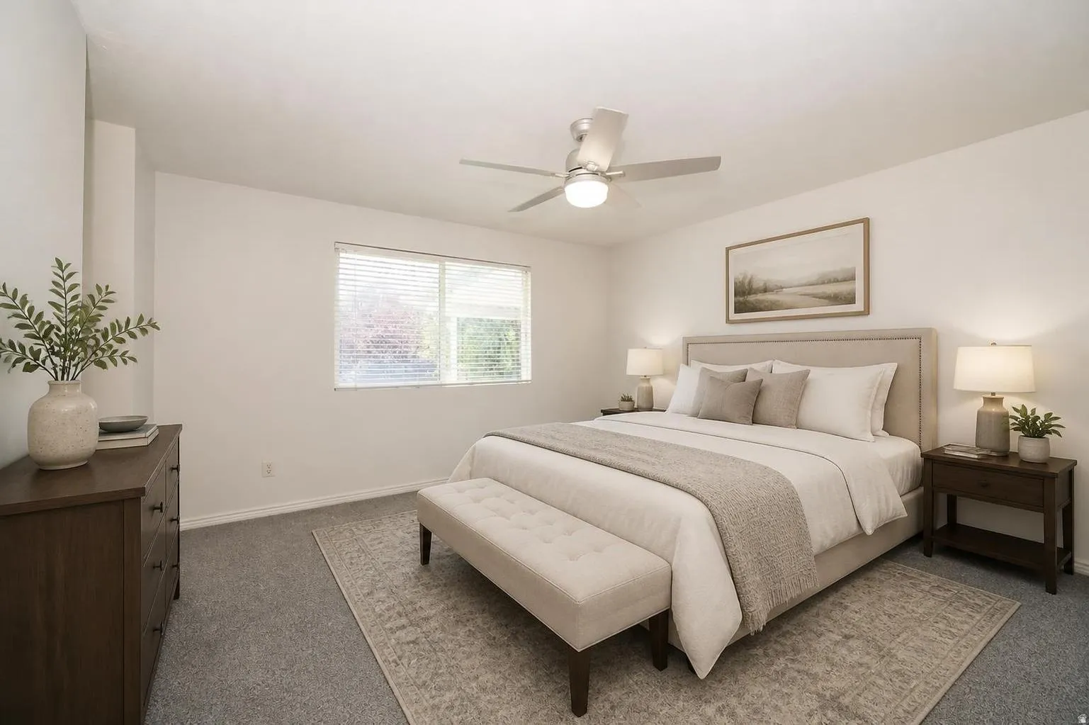 Wall-to-wall carpeting and a ceiling fan with integrated lighting
