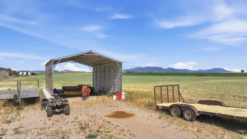 Open-sided metal shed providing covered storage