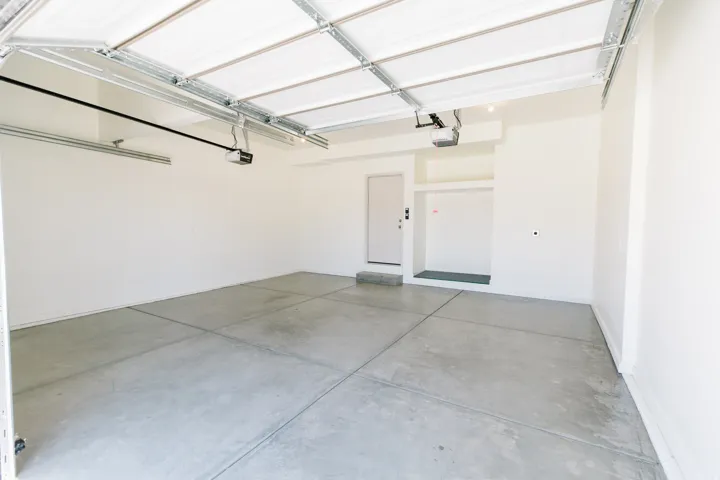 Spacious two-car garage with overhead door opener systems
