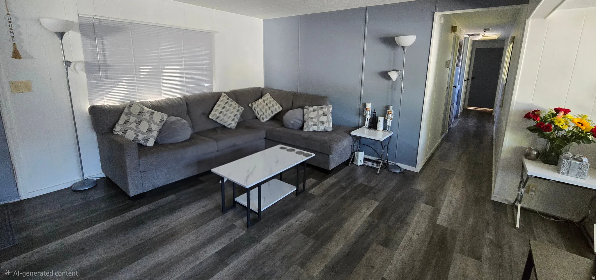 Spacious living area featuring wood-finish flooring, a neutral color palette, and a textured accent wall